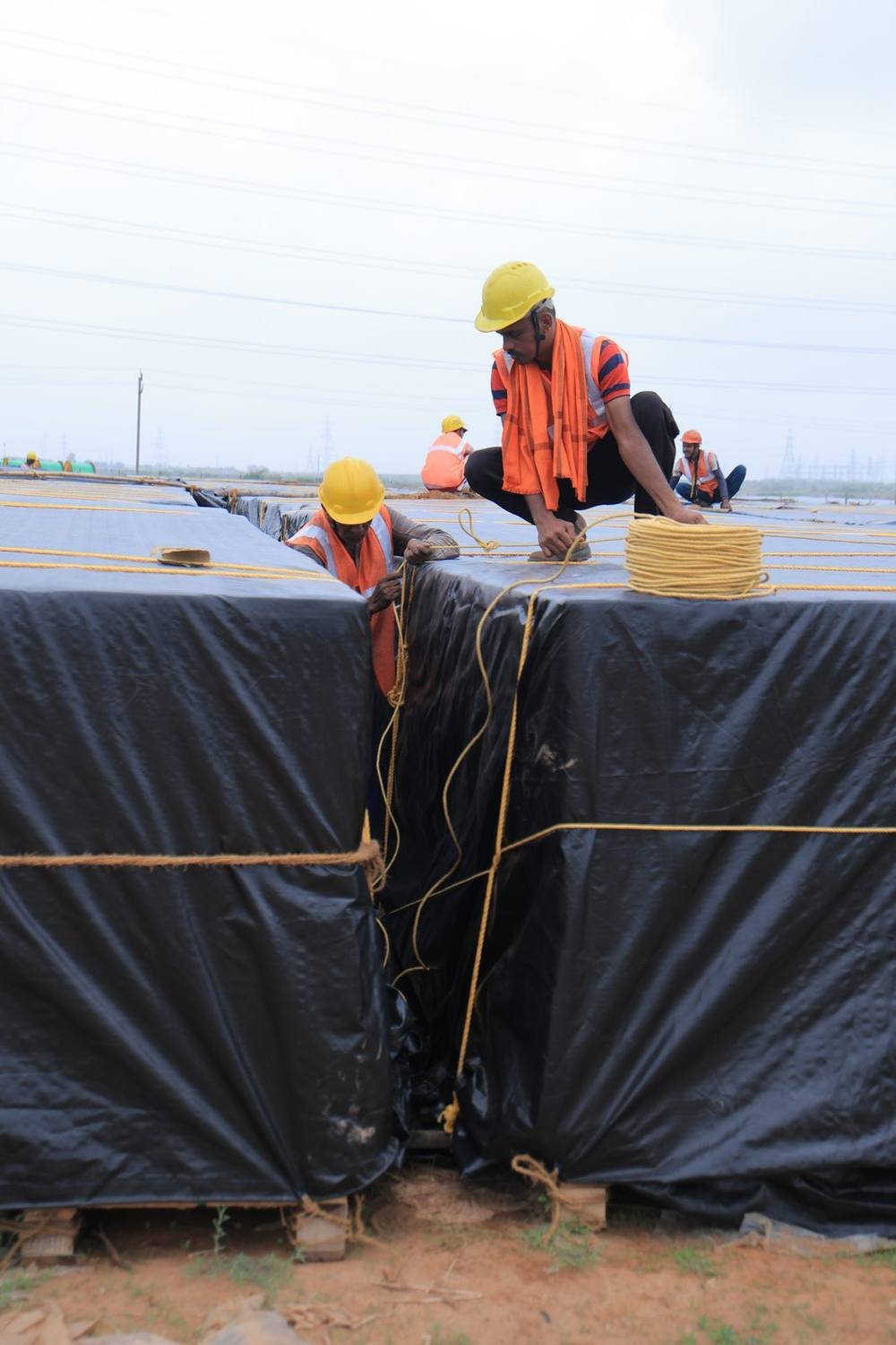 Tarpaulin sheeting drawn over a covered bay