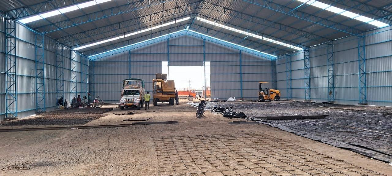 Warehouse interior under a clear-span shed
