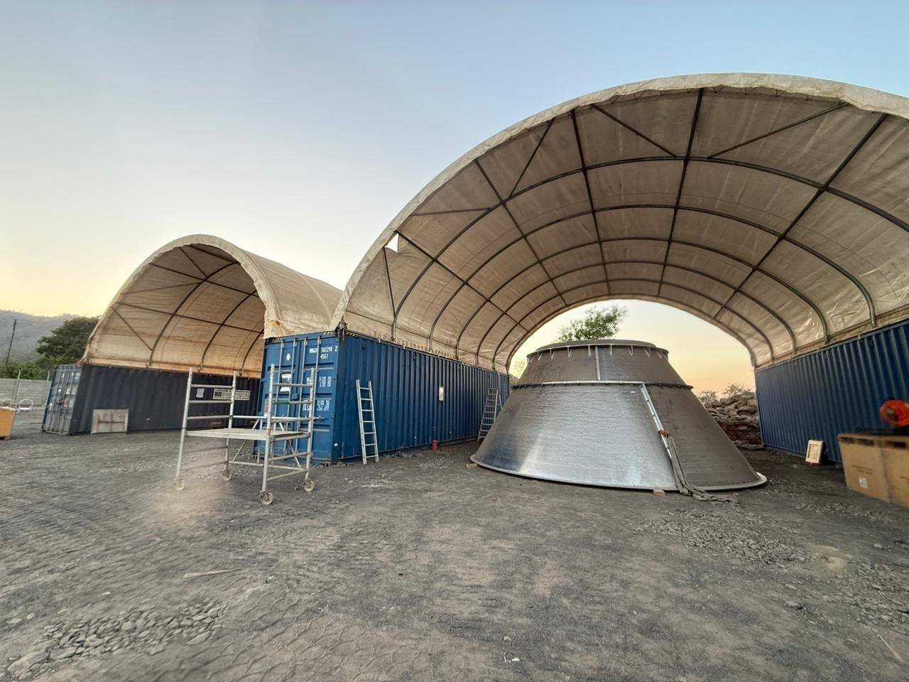 Shed structure at dusk on a project site