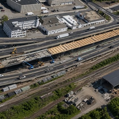 Aerial view of an elevated highway and bridge deck under construction