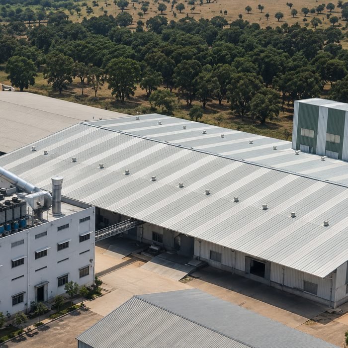Corrugated galvanised iron sheet roofing over a factory