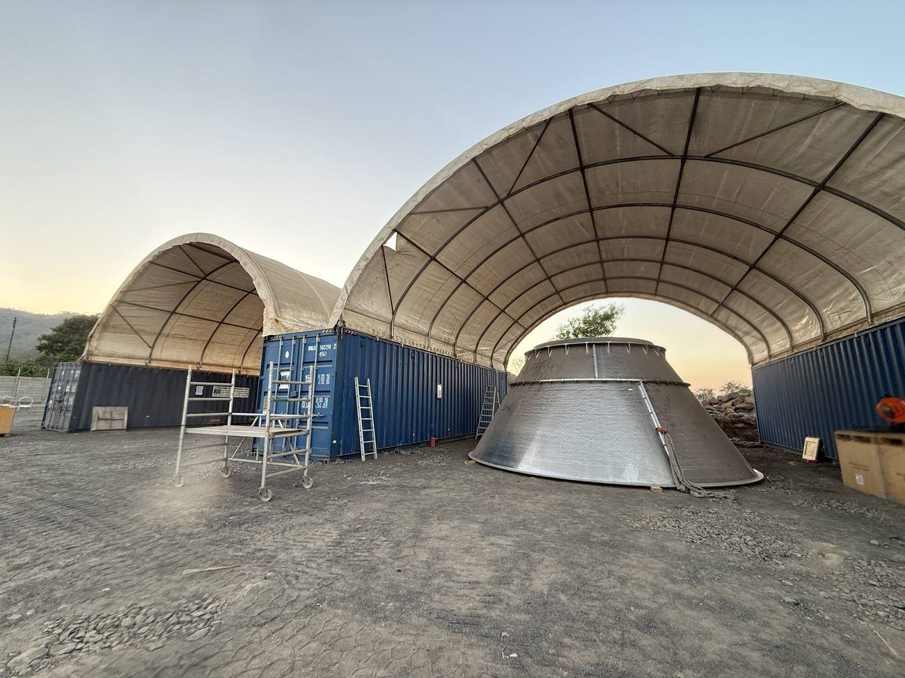 Completed tarpaulin-covered structure handed over on site